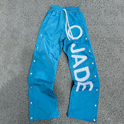 Custom-Nylon-Sweatpants für Männer mit elastischer Taille und reflektierendem Druck